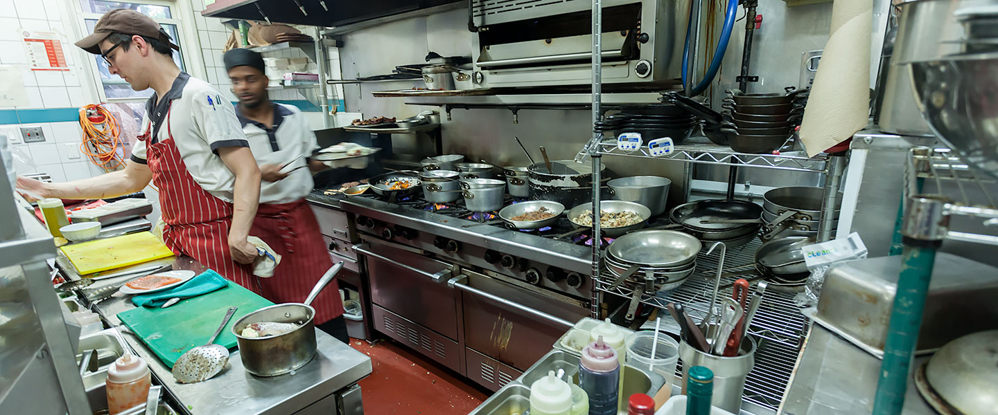 Two chefs preparing food at Harvest Kitchen